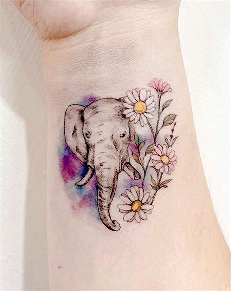 feminine elephant tattoos|More.